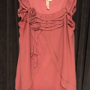 Rose colored sleeveless blouse